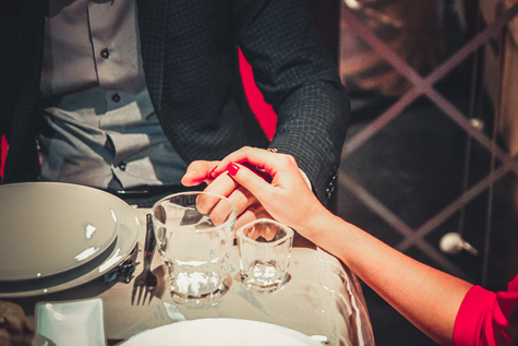 depositphotos_60007413_origina.jpg 2 HANDS at dinner Image